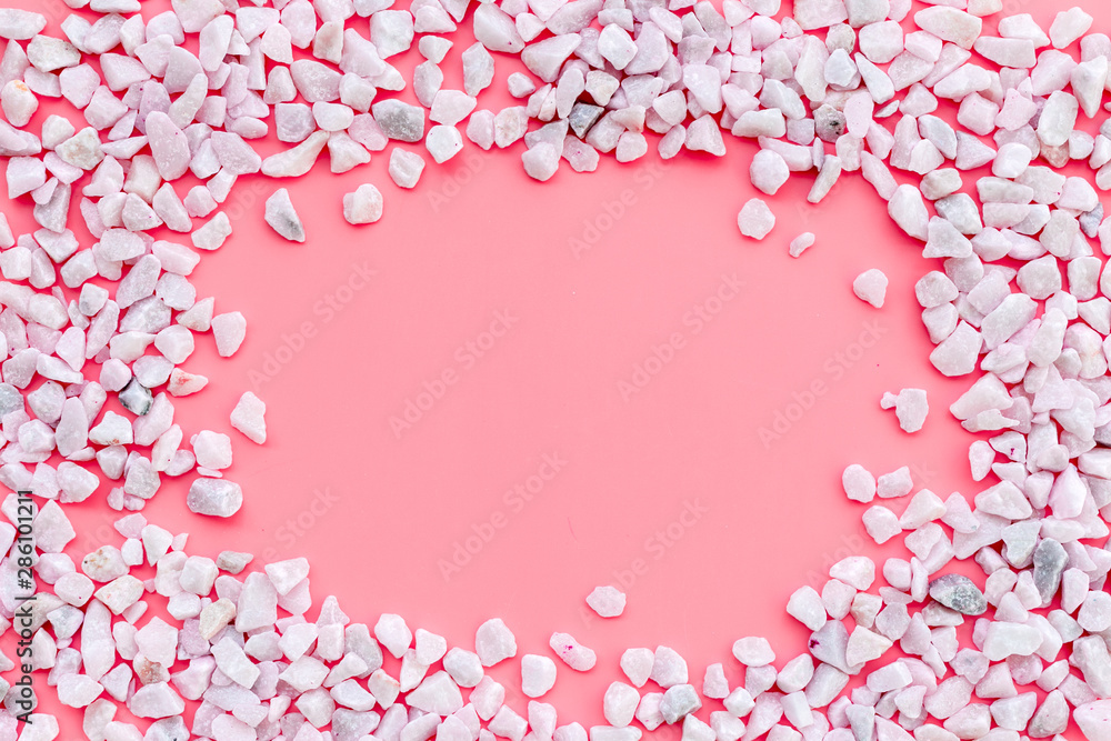 decorative pebble frame for design on pink background top view mockup