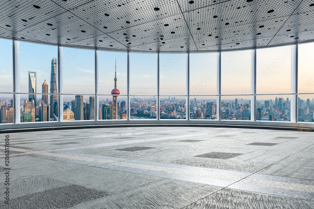 Empty floor and city skyline with buildings at sunset in Shanghai,China.