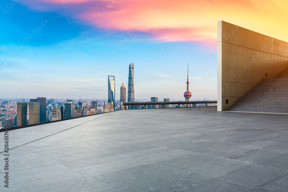 Empty square floor and city skyline with buildings at sunset in Shanghai,China.