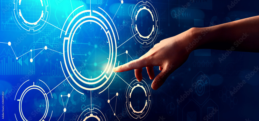 Tech circle with hand pressing a button on a technology screen