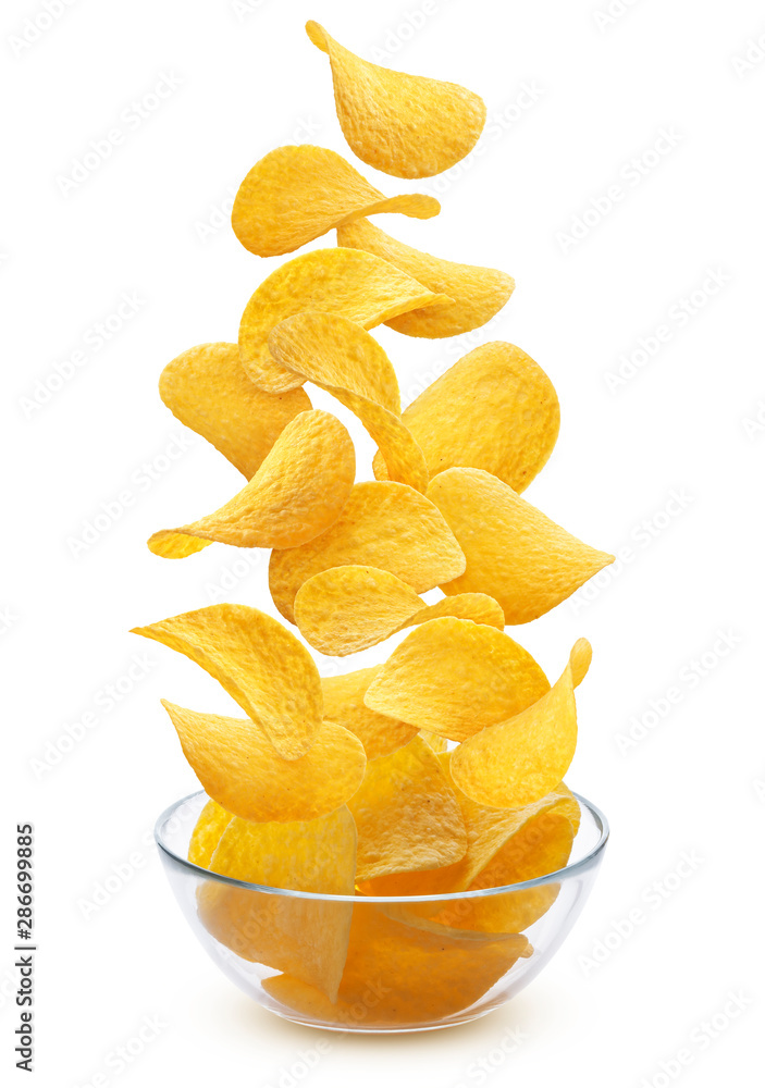 Delicious crispy potato chips pile in glass bowl