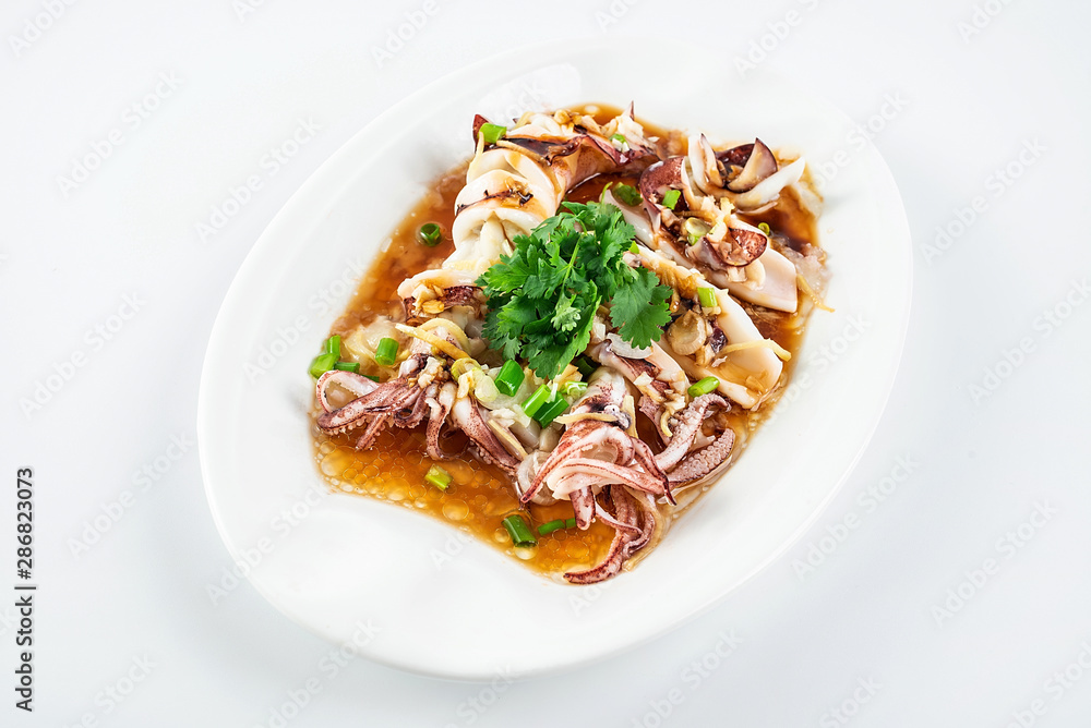 Chinese Cantonese cuisine home cooking, a dish of garlic steamed tubule squid on a white background