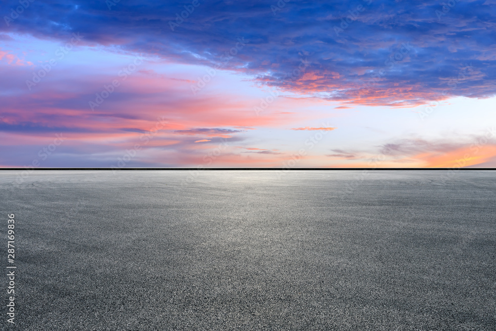 Empty race track road and beautiful sky clouds at sunset