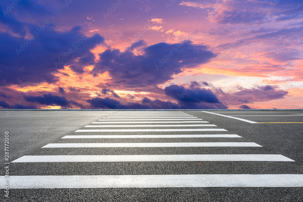 Crosswalk road and beautiful sky clouds at sunset