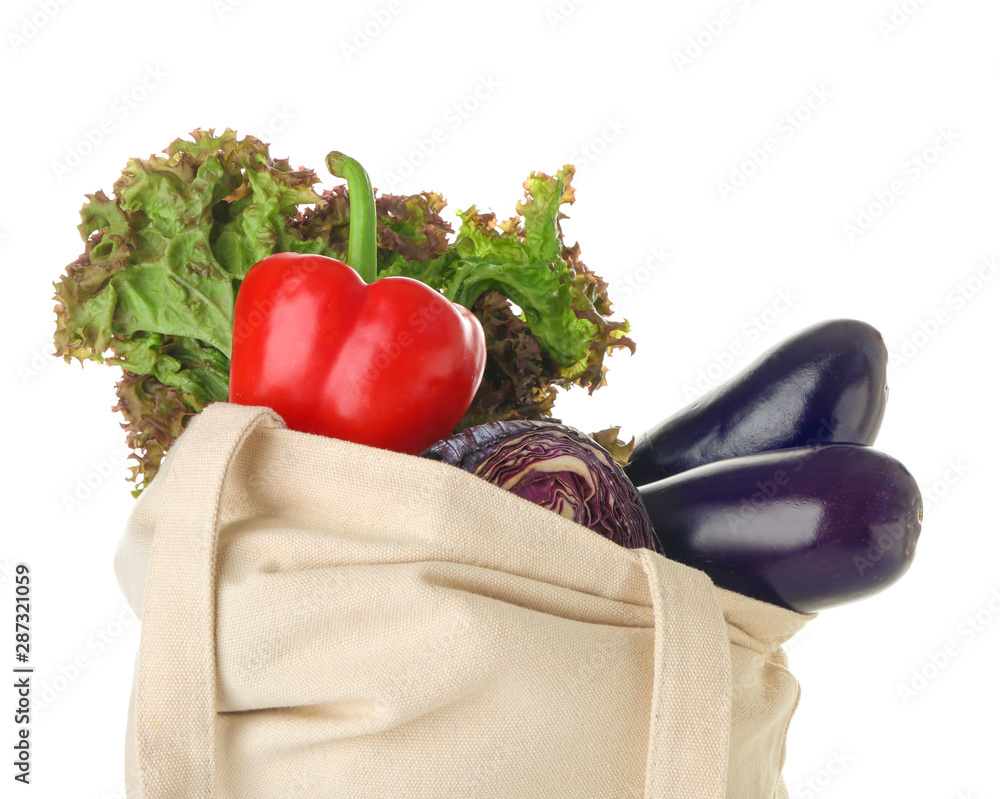 Stylish eco bag with fresh vegetables on white background