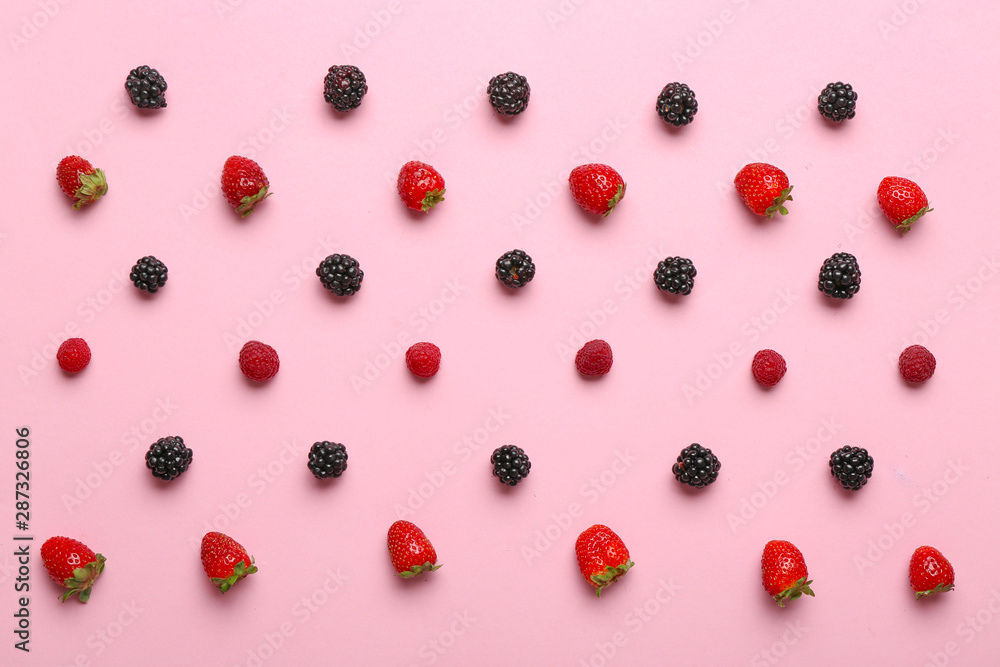 Many sweet ripe berries on color background