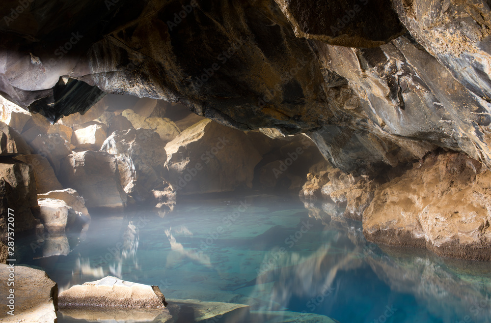 Natural hot geothermal spring cave Grjótagjá in Iceland, Europe.