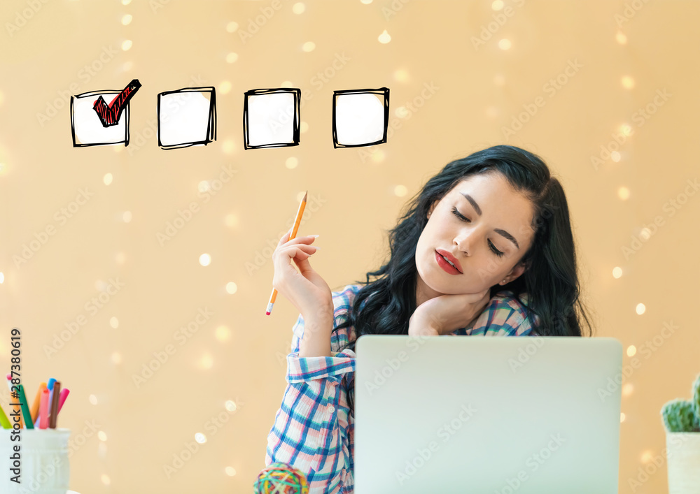 Checklist with young woman holding a pencil