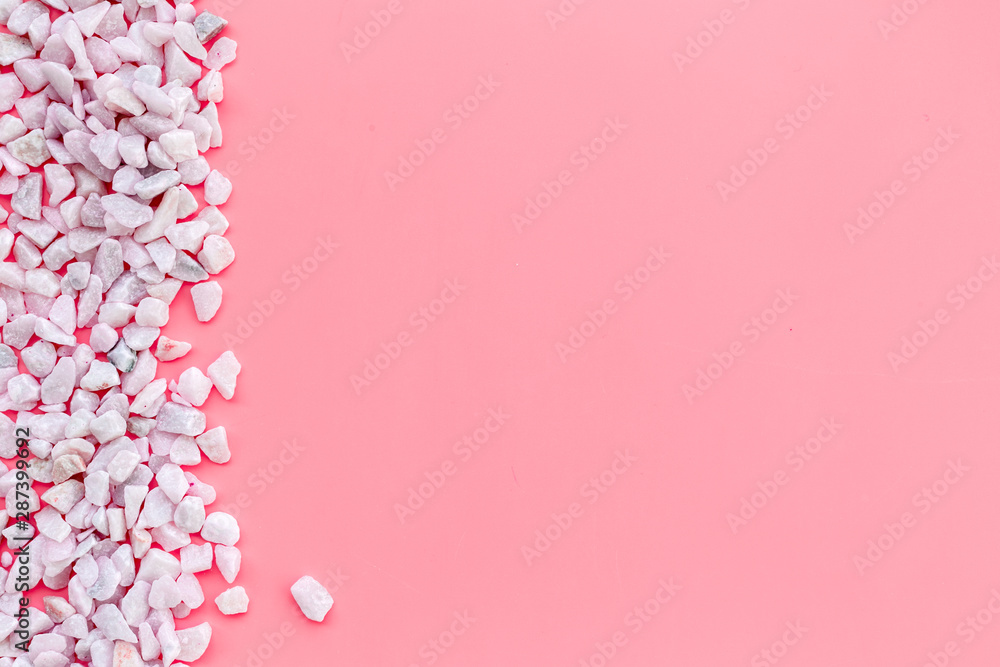 Design with pebble frame on pink background top view space for text