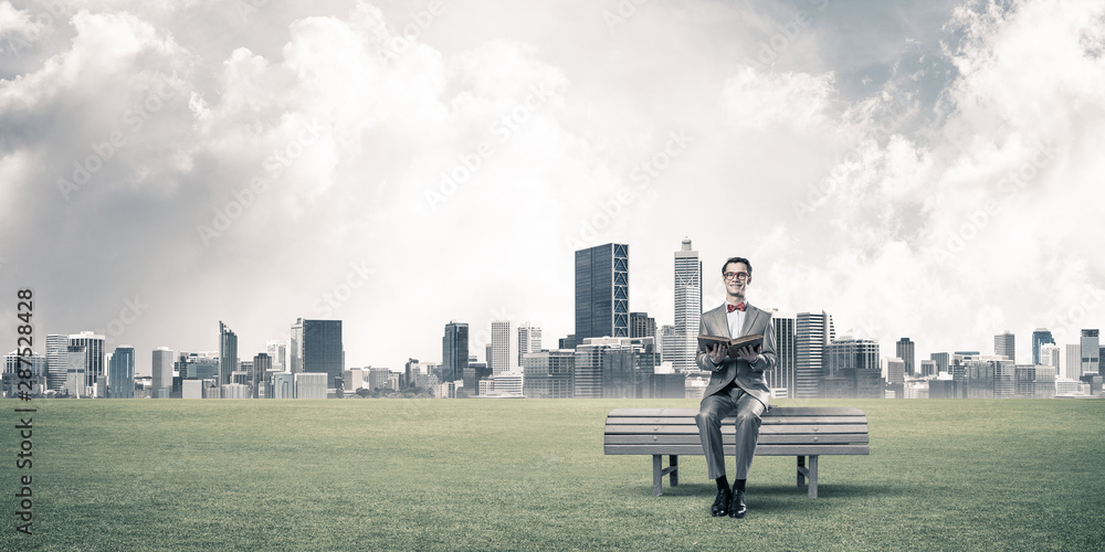 Young businessman or student studying the science and cityscape at background