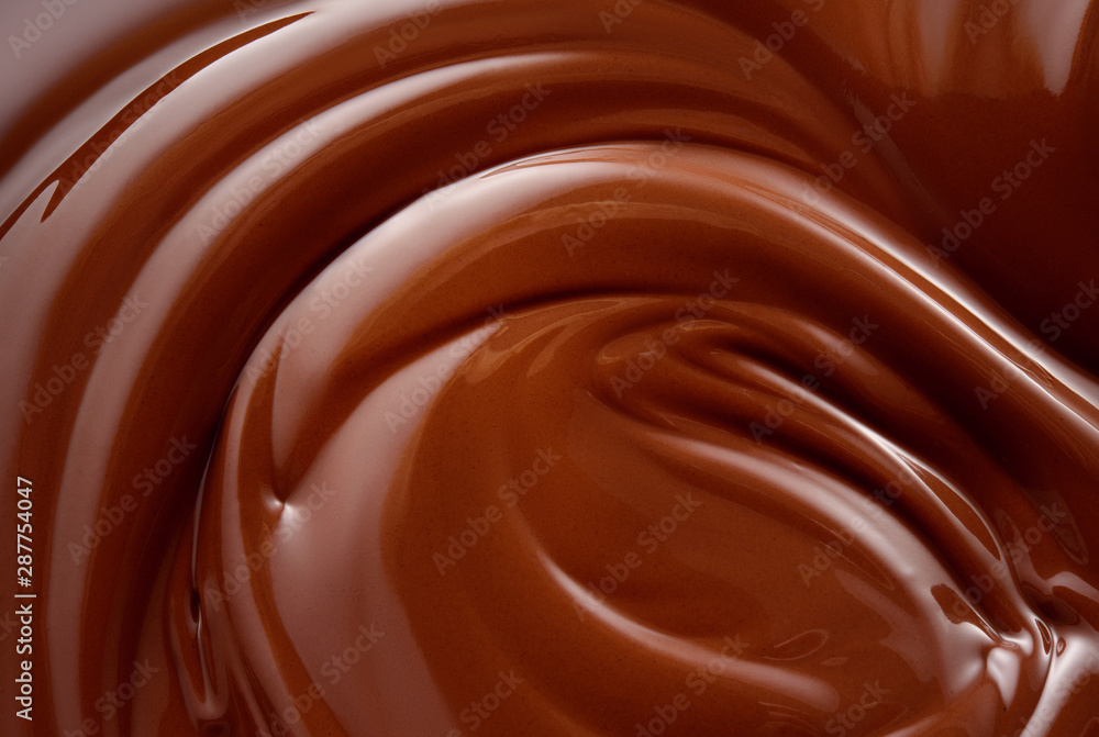 Chocolate background. Melted chocolate surface. Chocolate swirl.