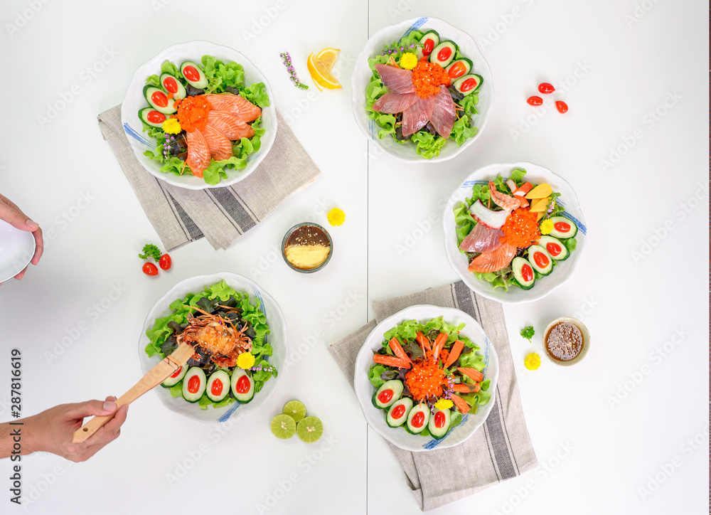 Variety of Salad with Salmon, Maguro, Spider crab,Kani and Seafood set on the table