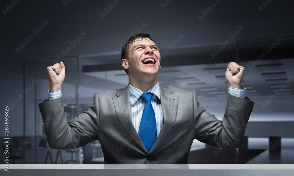 Happy excited businessman celebrating victory