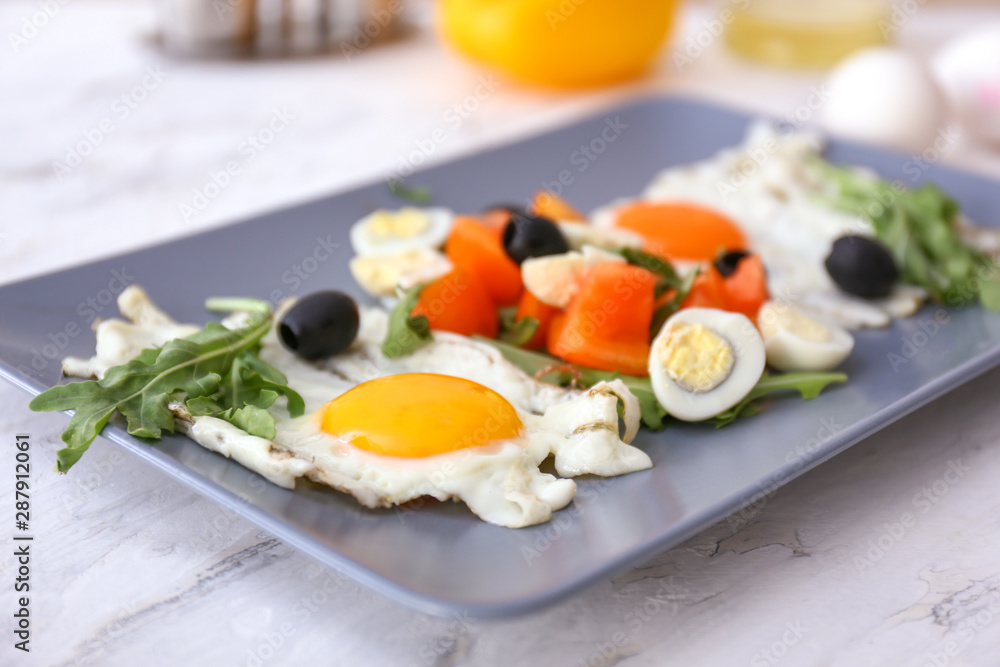 Plate with tasty salad on table, closeup