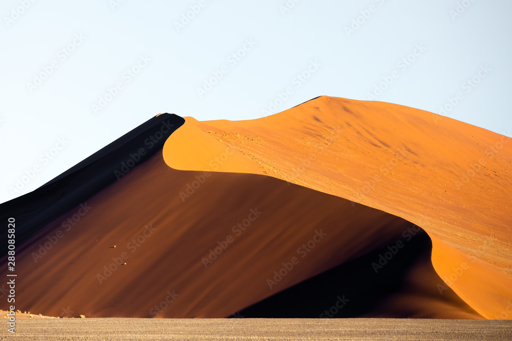 Deep colors of sand dunes during sunset. Sossusvlei, Namibia.