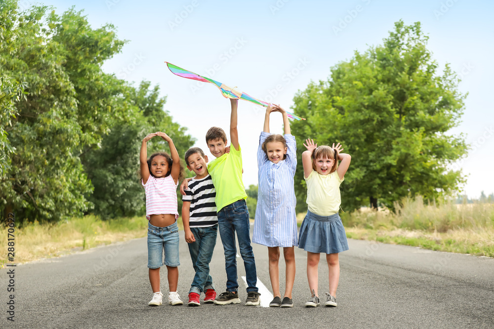 Little children flying kite outdoors