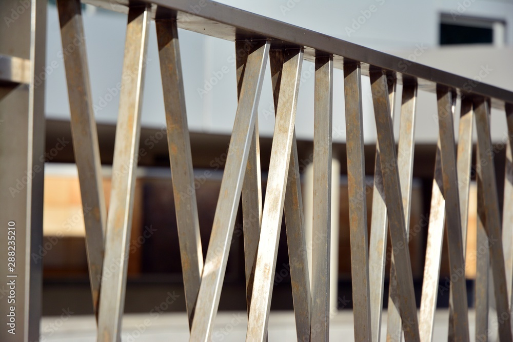 Chromium metal fence with handrail. Chrome-plated metal railings. Shallow depth of field. Selective 