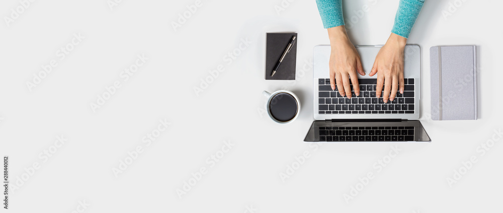 Person using a laptop computer from above