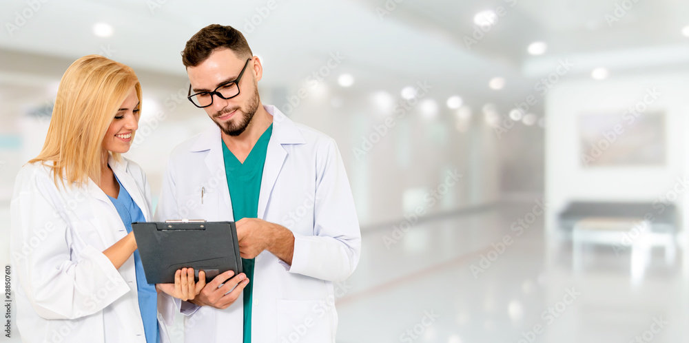 Doctor working with another doctor in the hospital. Healthcare and medical service.