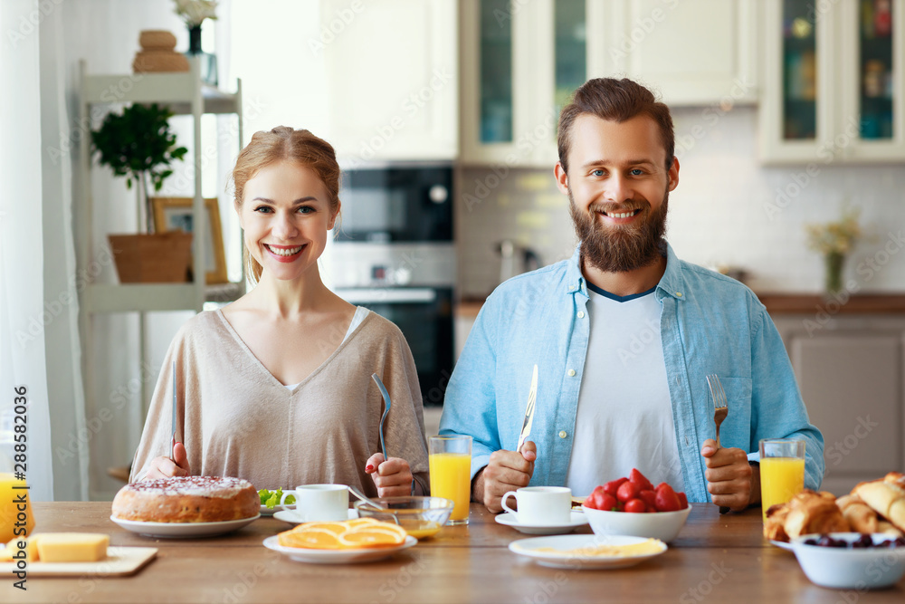 family happy couple have Breakfast in kitchen in morning.