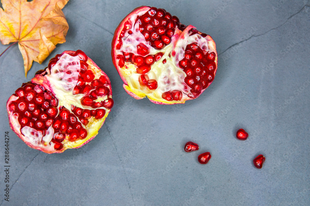 Sweet pomegranate over grey background