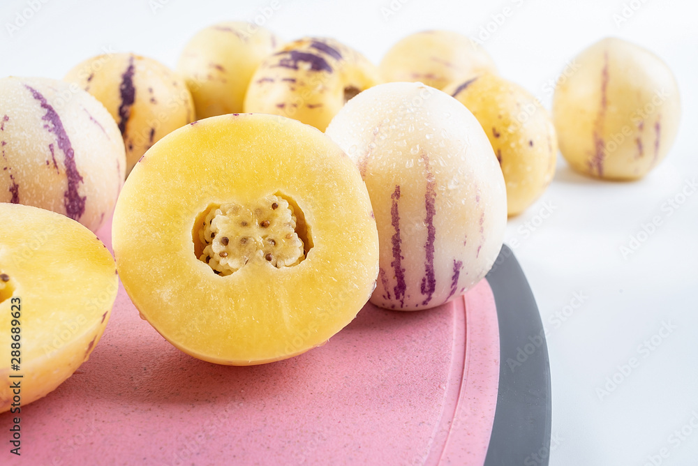 Fresh fruit ginseng cut on red cutting board