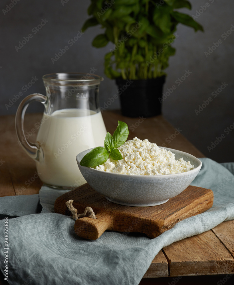 milk jug and bowl of cottage cheese