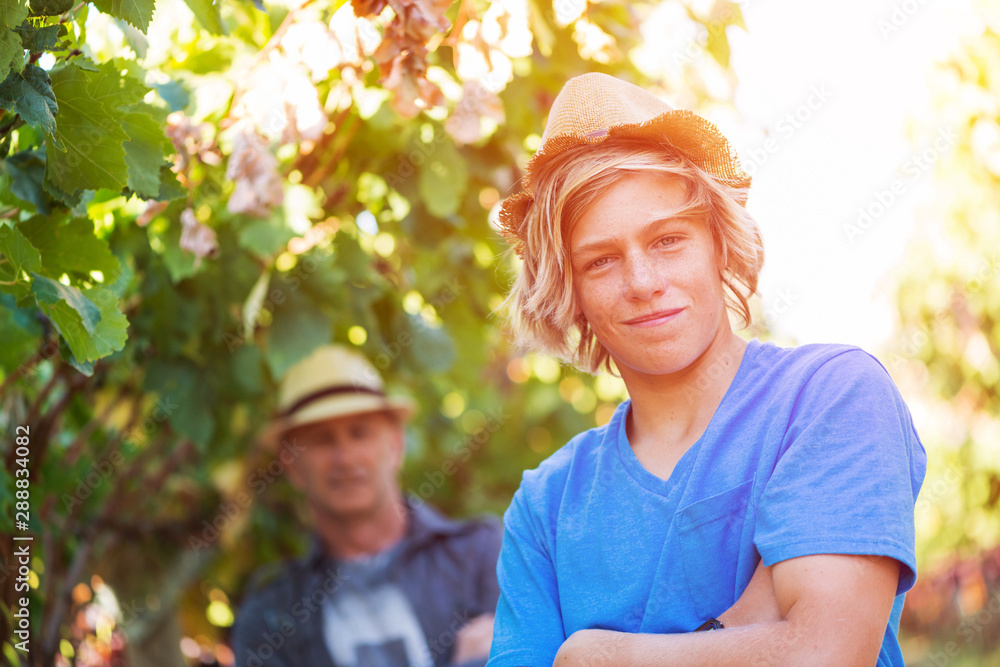 Portrait of guy in straw hat and t-shirt