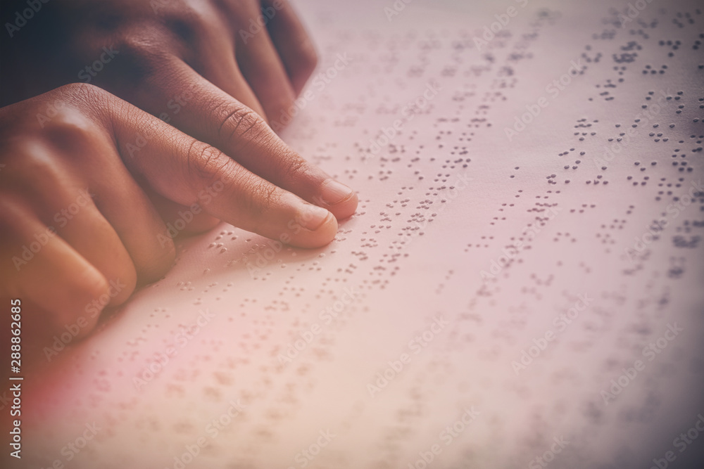 Child using braille to read