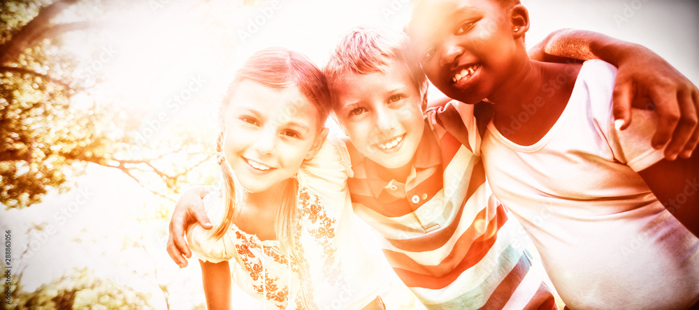 Kids posing together during a sunny day at camera