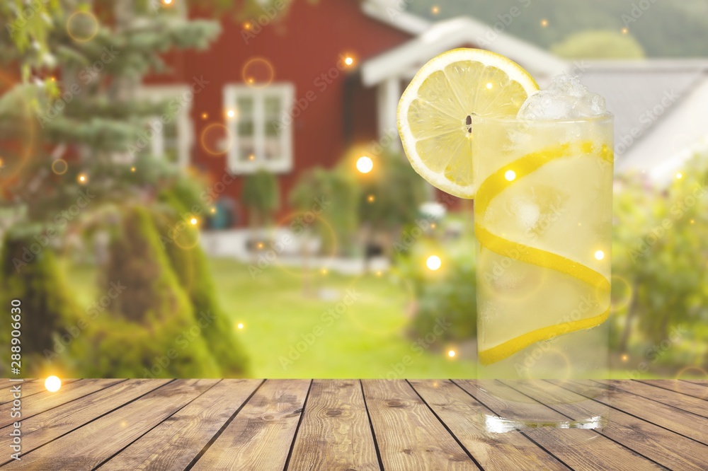 Lemonade with fresh lemon on  background