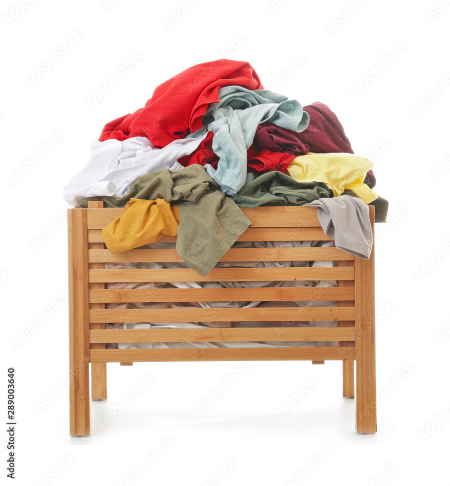 Wooden box with dirty laundry on white background