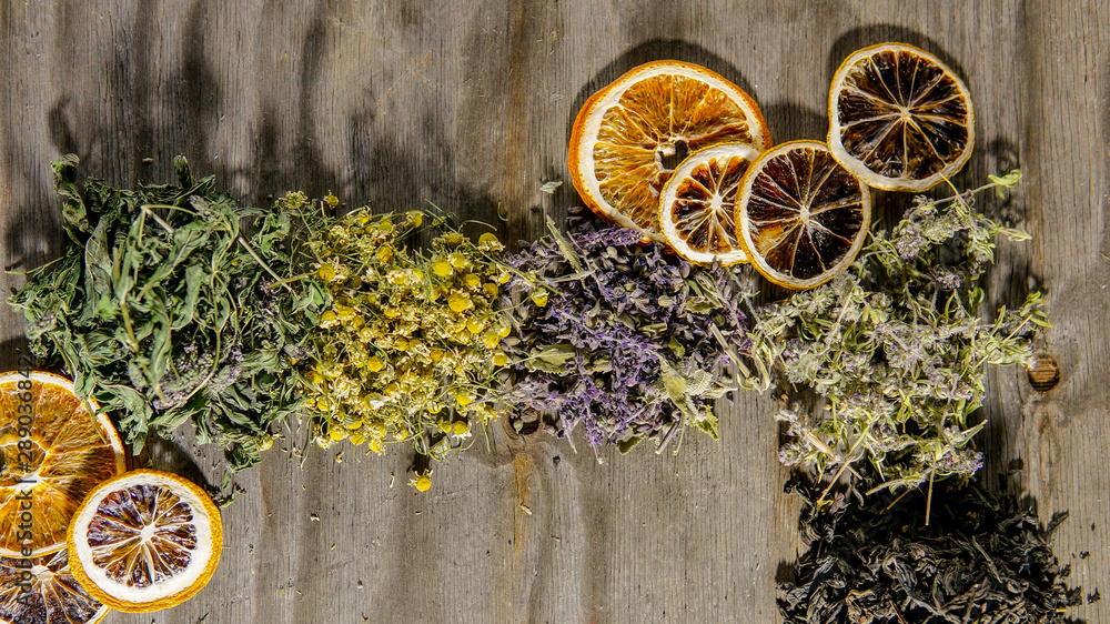 Collection of different tea over wooden background