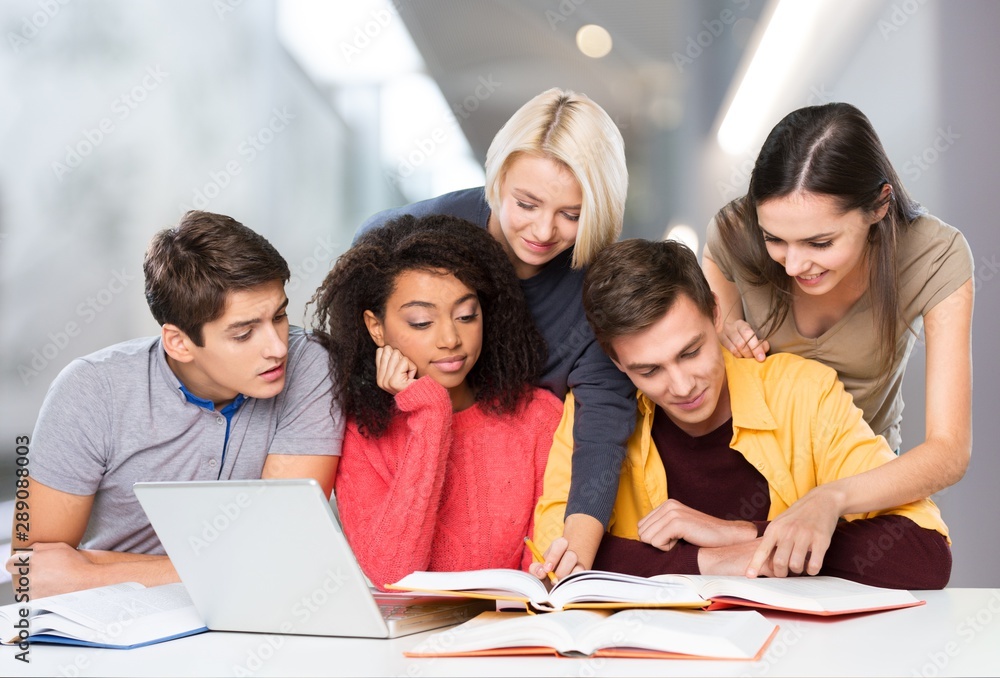 Four Young students studying subject on background