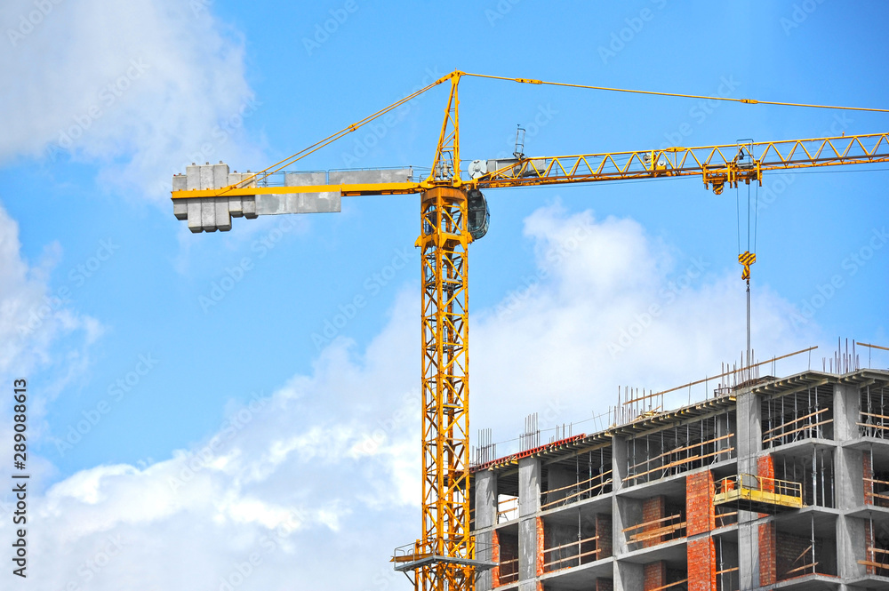 Crane and highrise construction site