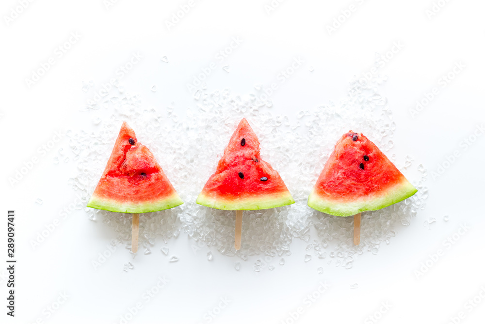 Popsicle from fresh watermelon and ice on white background top view