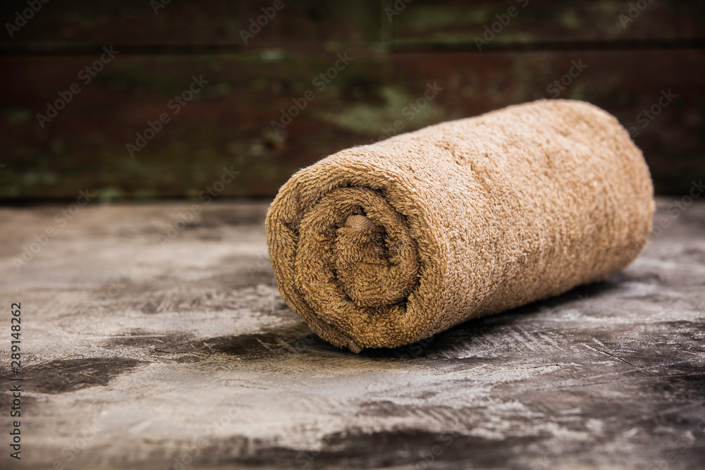 SPA towel on rustic background. SPA and relaxation concept