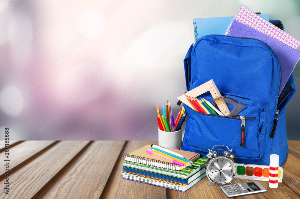 School bag on wooden  background.