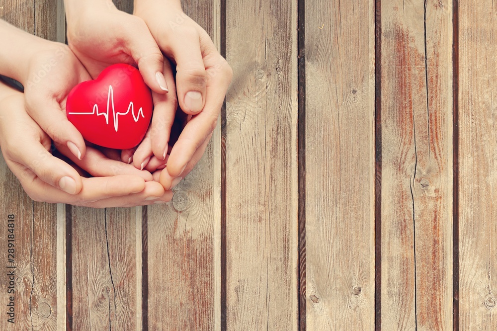 Close-up red Heart in hands, love concept