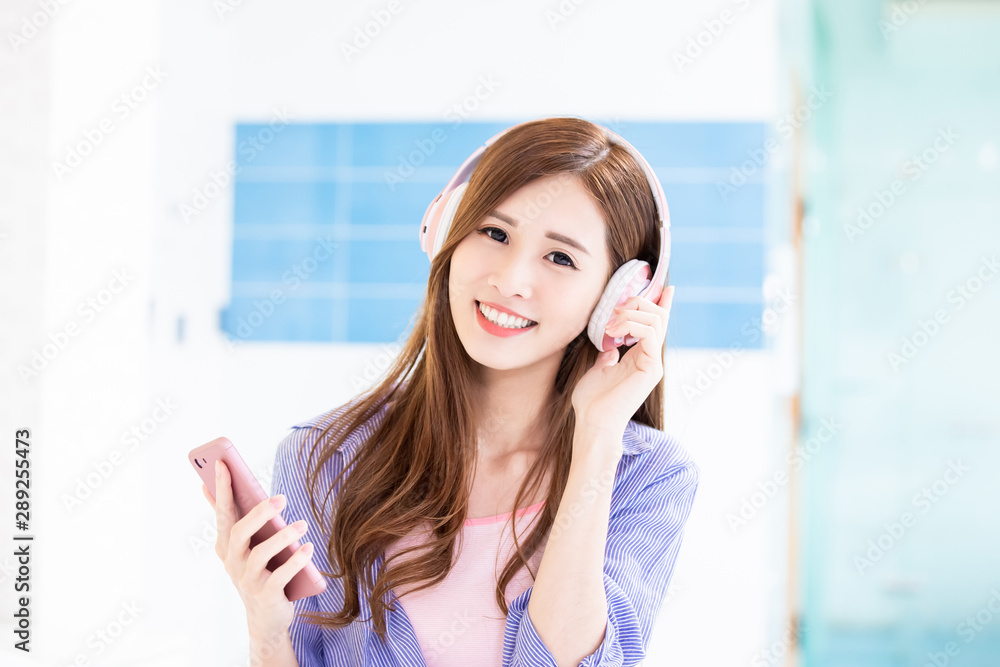 Young woman listen to music