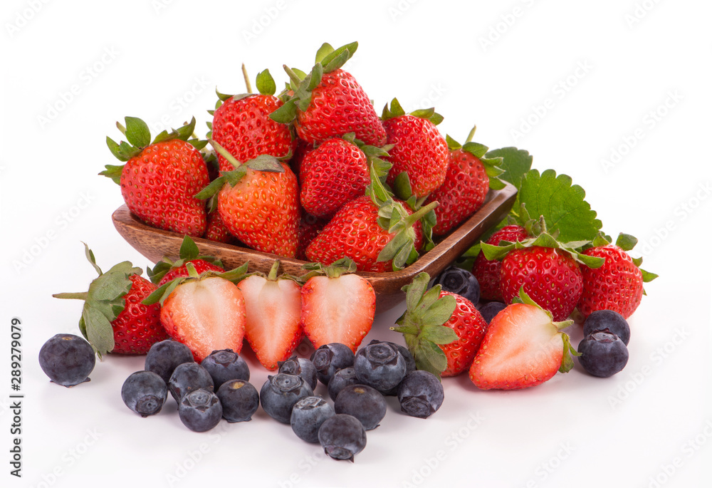 A bowl set of beautiful and delicious strawberry and blueberry isolated on white background, close u