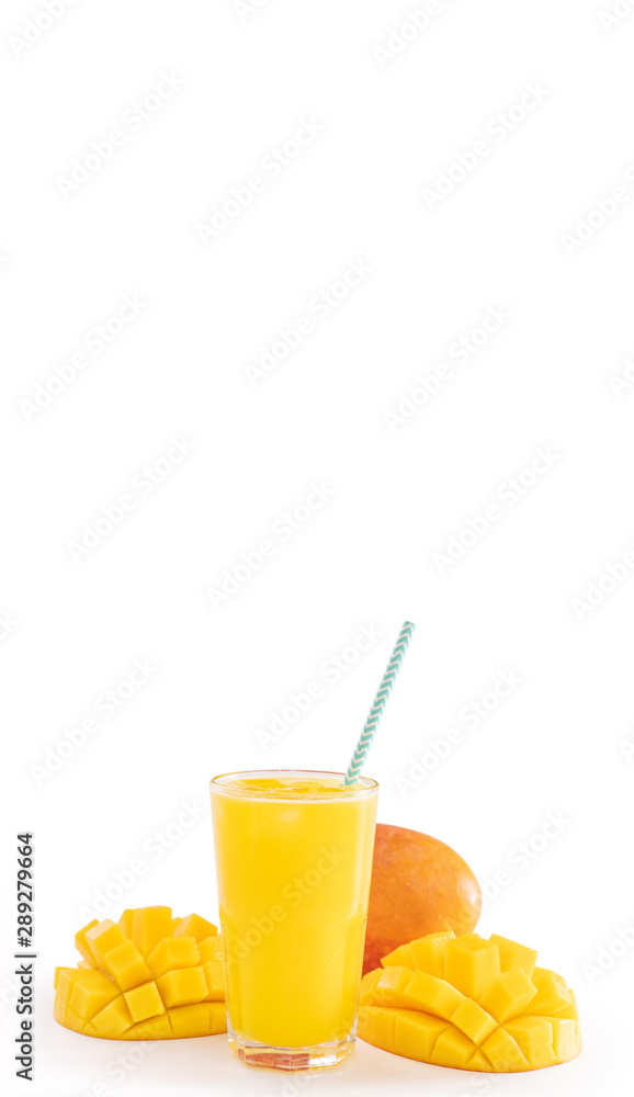 Fresh tropical mango juice with beautiful diced pulp and striped paper straw isolated on white backg