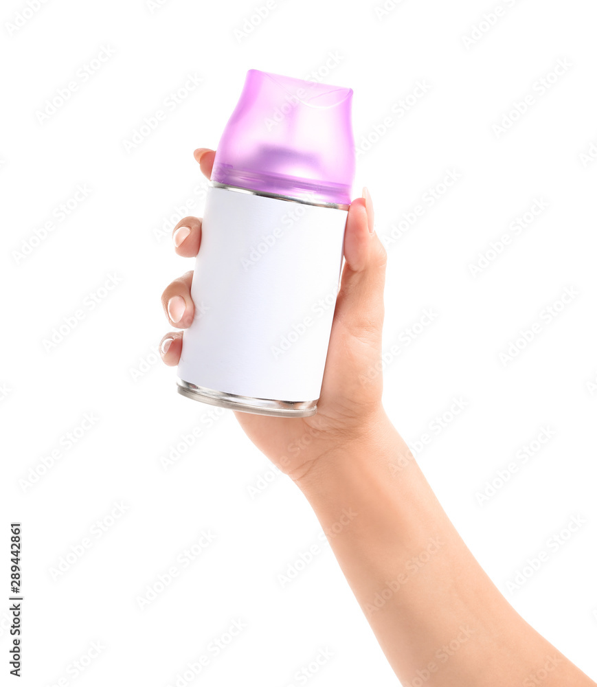 Female hand with bottle of air freshener on white background