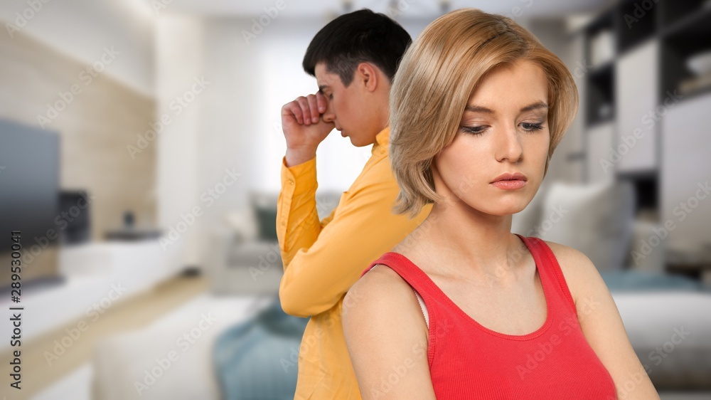 Sad young couple isolated on white