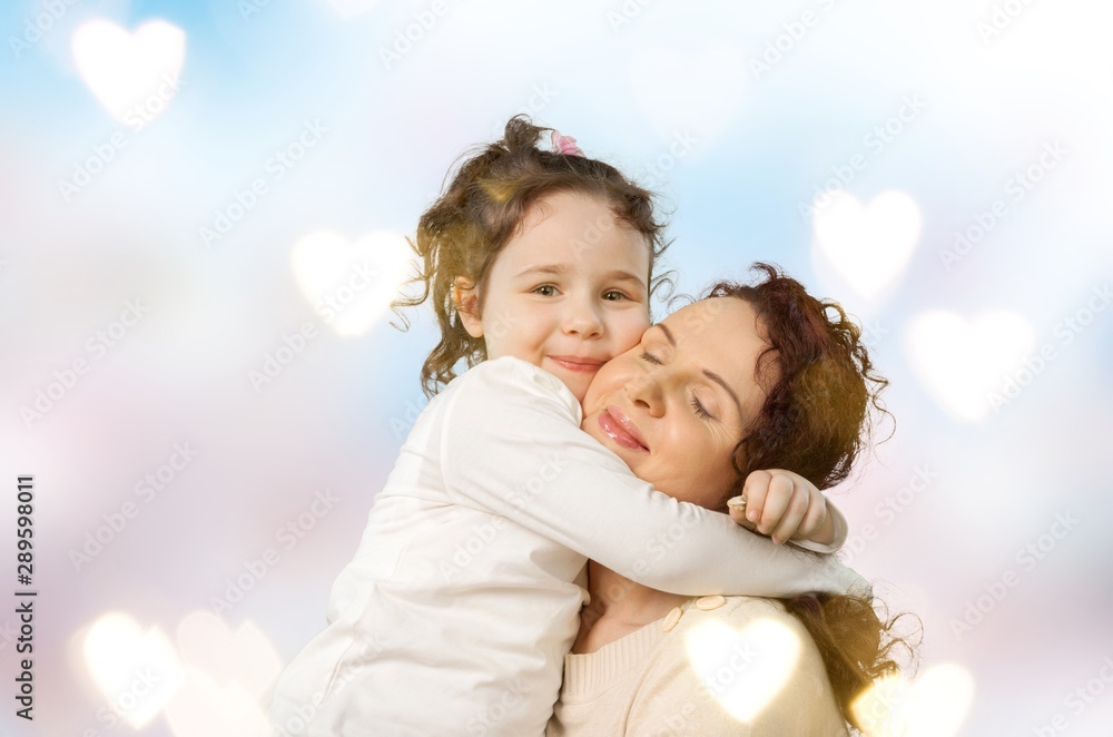 Happy Mother and daughter hugging, happy family, mothers day.