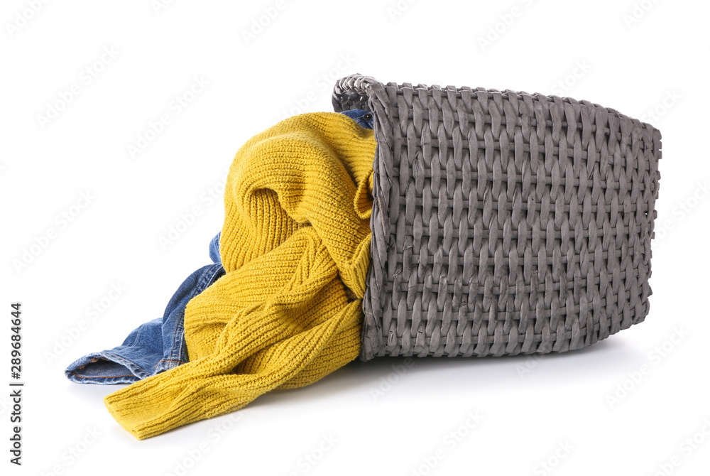 Basket with laundry on white background