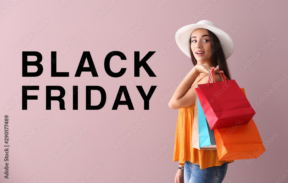 Beautiful young woman with shopping bags on color background. Black Friday sale