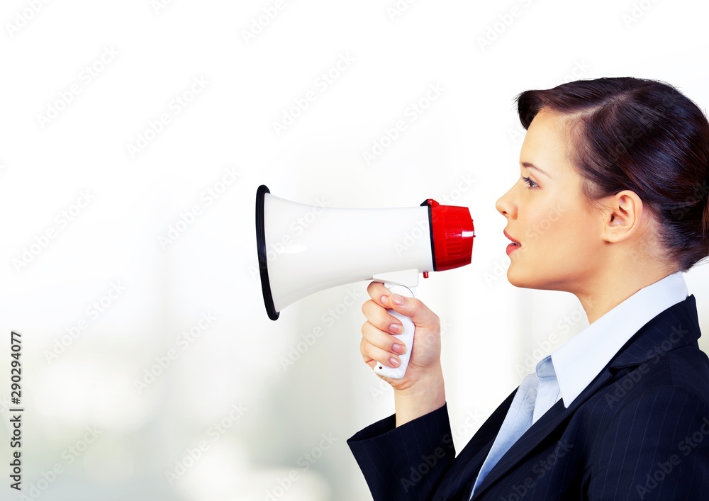 Portrait of woman holding megaphone, dressed in pin-up style