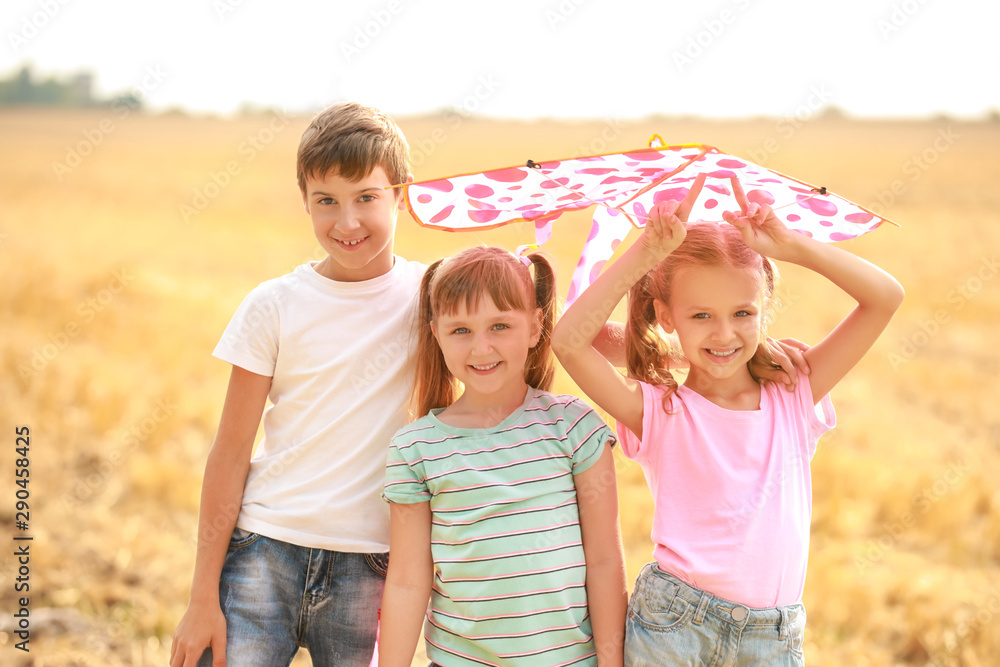 Little children flying kite outdoors