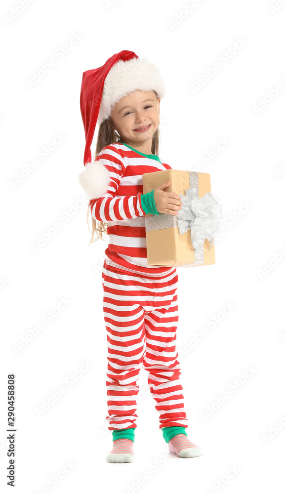 Cute little girl in Santa hat and with Christmas gift on white background